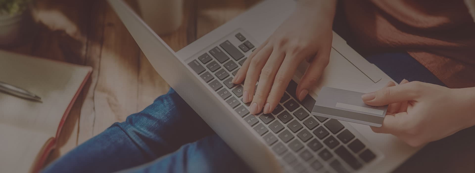 Hands typing on a laptop next to product recommendation data