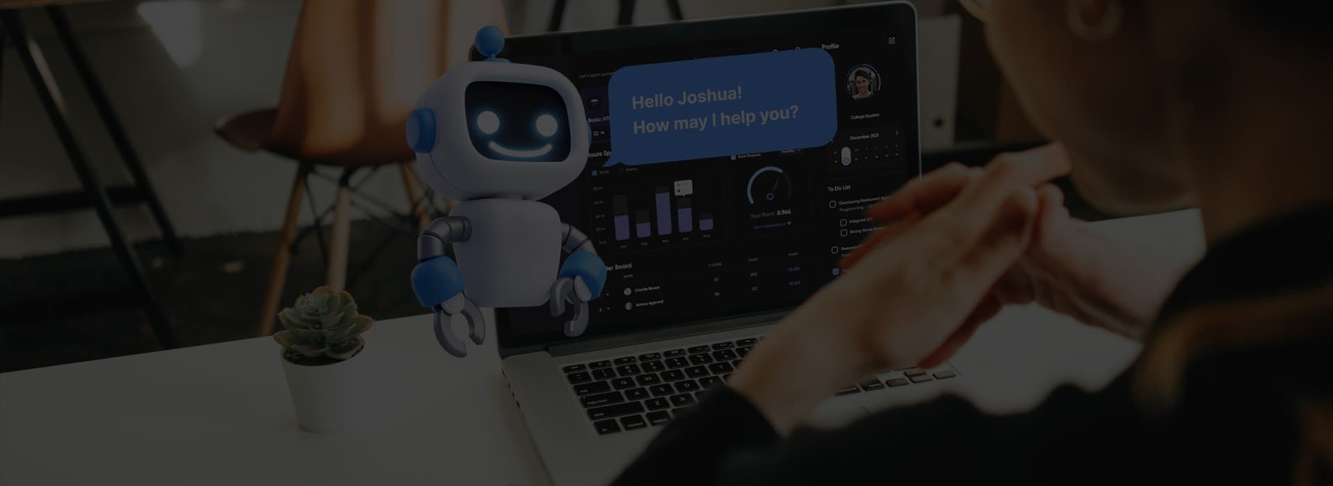 Small robot next to a laptop with a chatbot conversation
