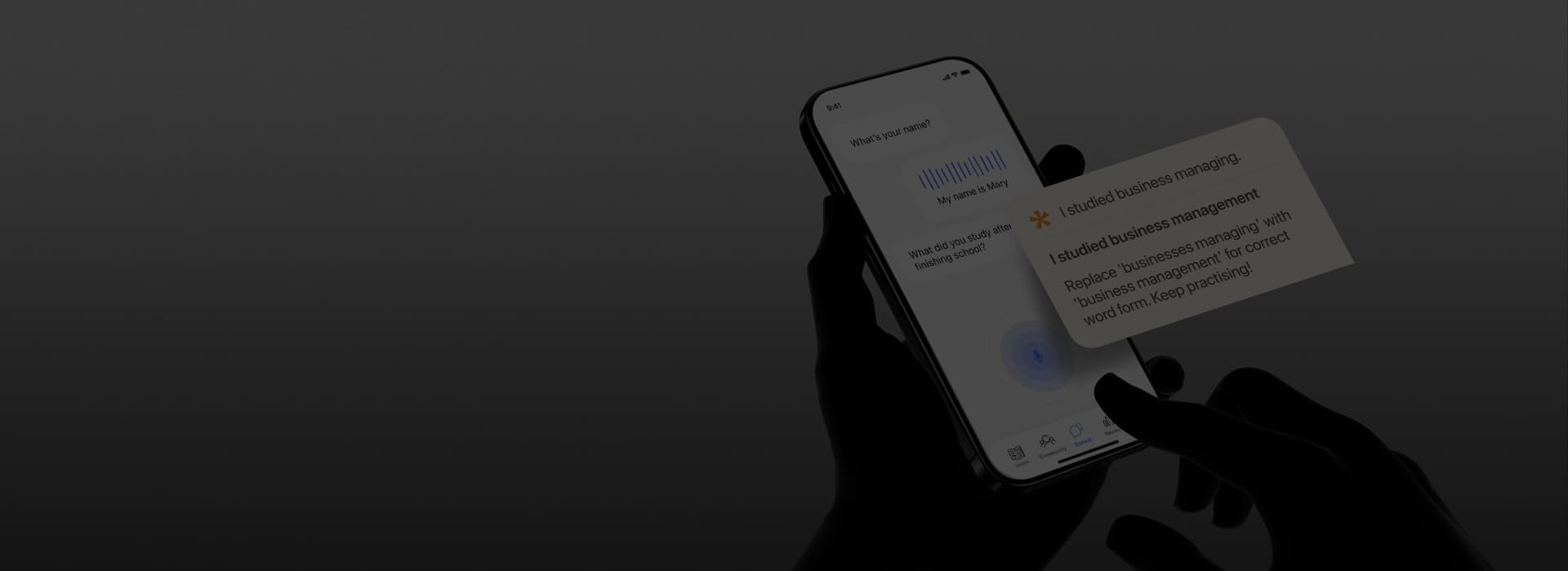 Hand holding a phone with an AI conversation in a language learning app