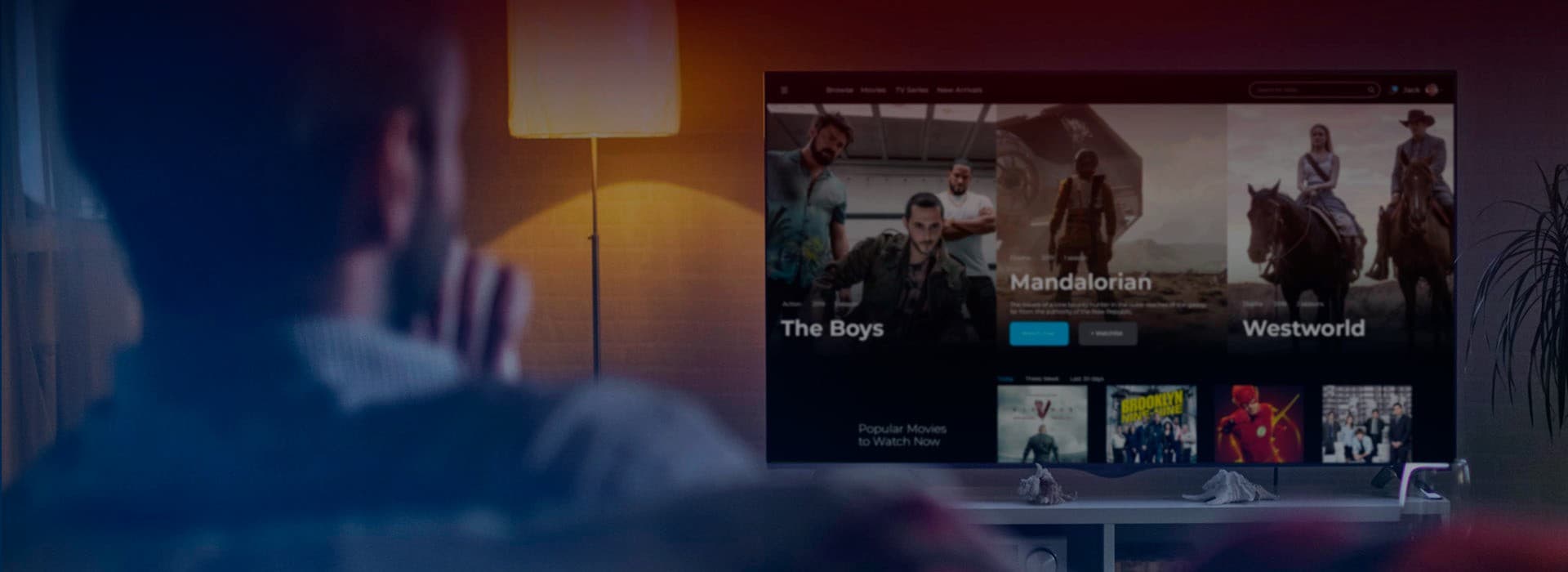 Man watching a TV with a chatbot app interface