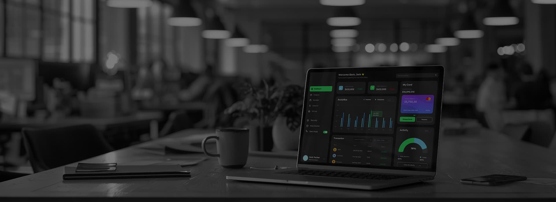 Laptop showing fintech dashboards in an office