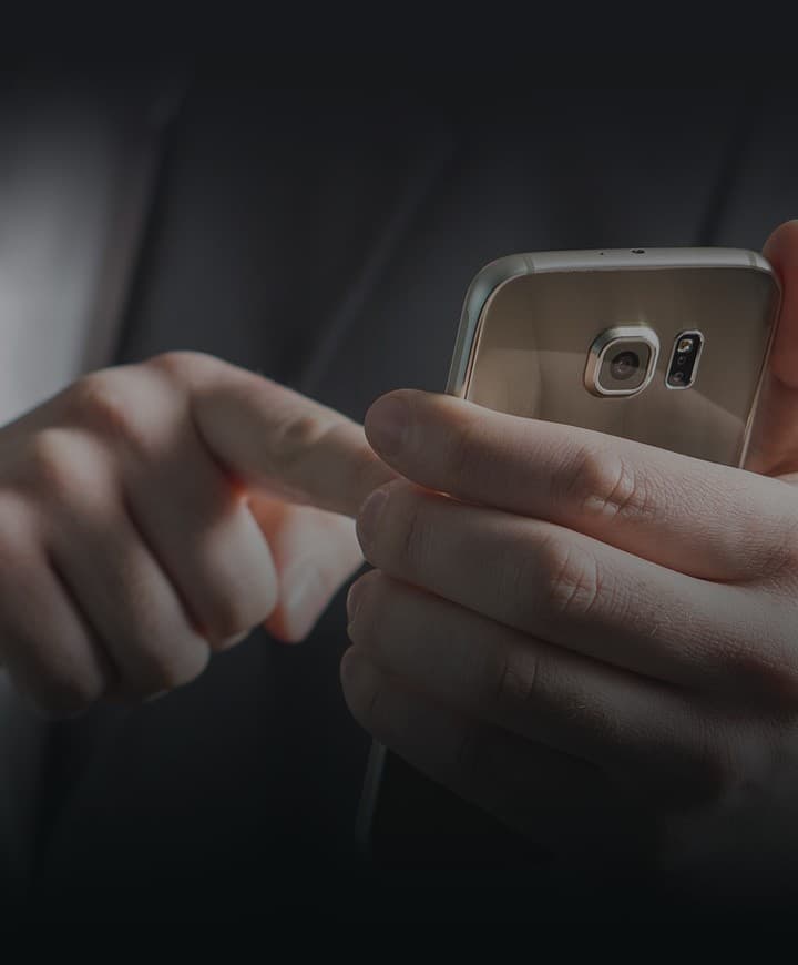 Hands holding a phone with a smart mobile payments app